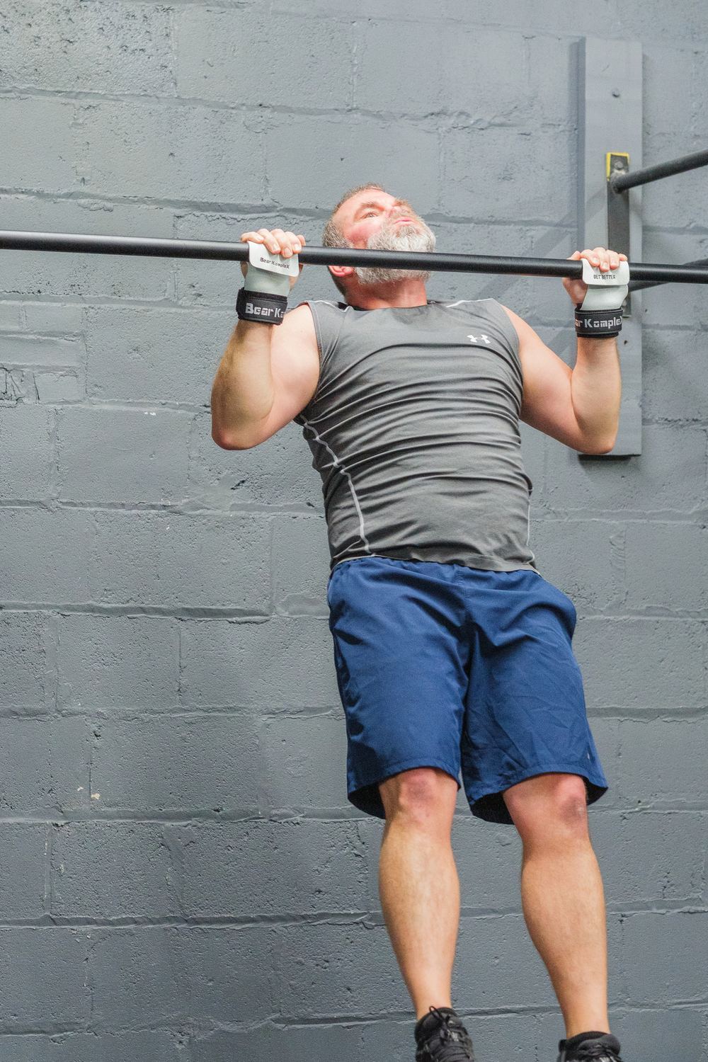 A member working through a pull-up during a CrossFit class at RNF CrossFit in Glasgow, KY